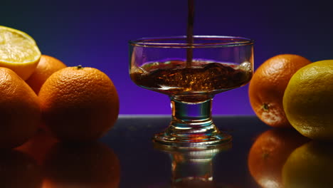 pouring drink over fruits