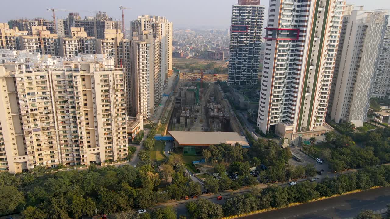 Aerial drone shot capturing a massive construction site between high ...