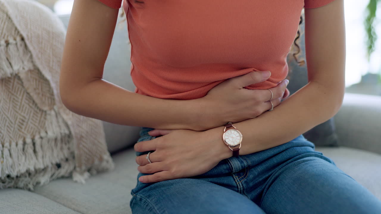 Stomach ache, pain and hands of sick woman