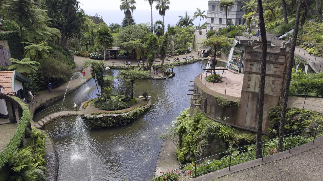 Peaceful garden overview in Madeira featuring a fountain surrounded by greenery