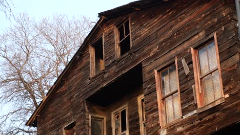 old wooden house with broken windows