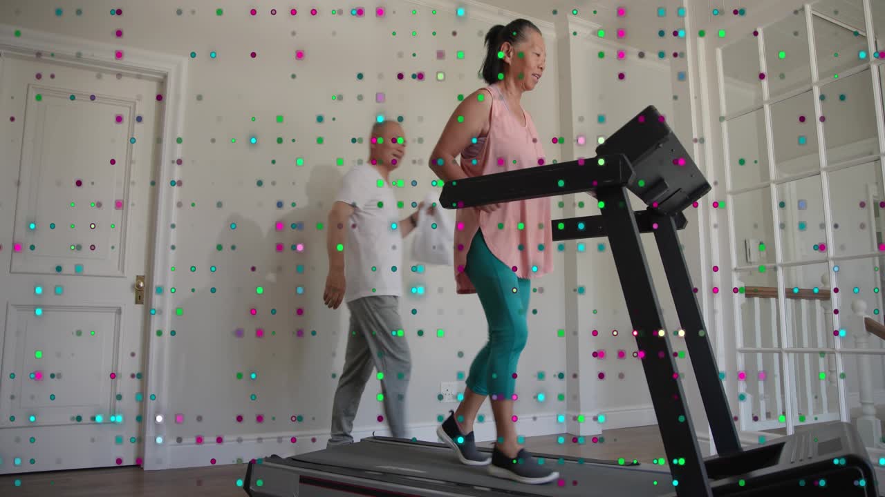 Senior woman walking treadmill tapping console causing animated metrics for health man walking past