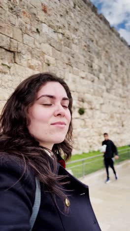 young woman selfie by ancient jerusalem wall