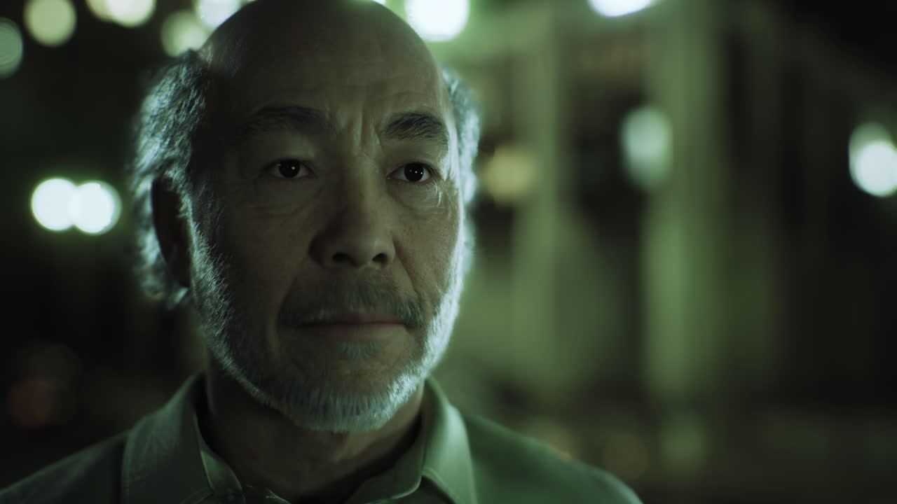 Portrait of an Older Asian Man at Night