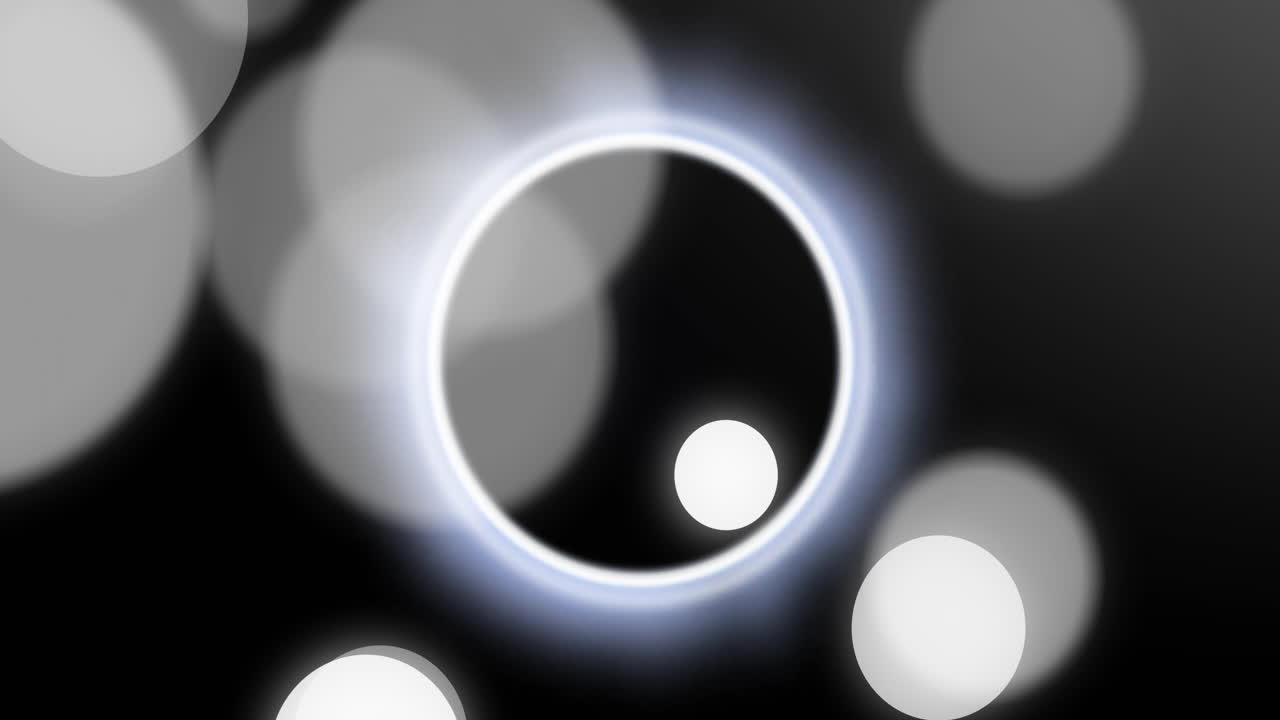 Animation of white and black spots moving over black background