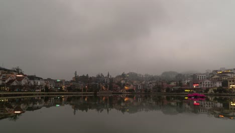 da lat city at night with foggy reflection on lake