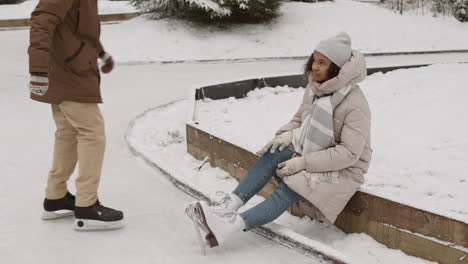 couple ice skating in the snow