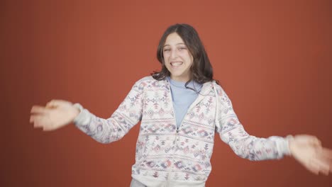 Happy-young-woman-waving-at-camera.