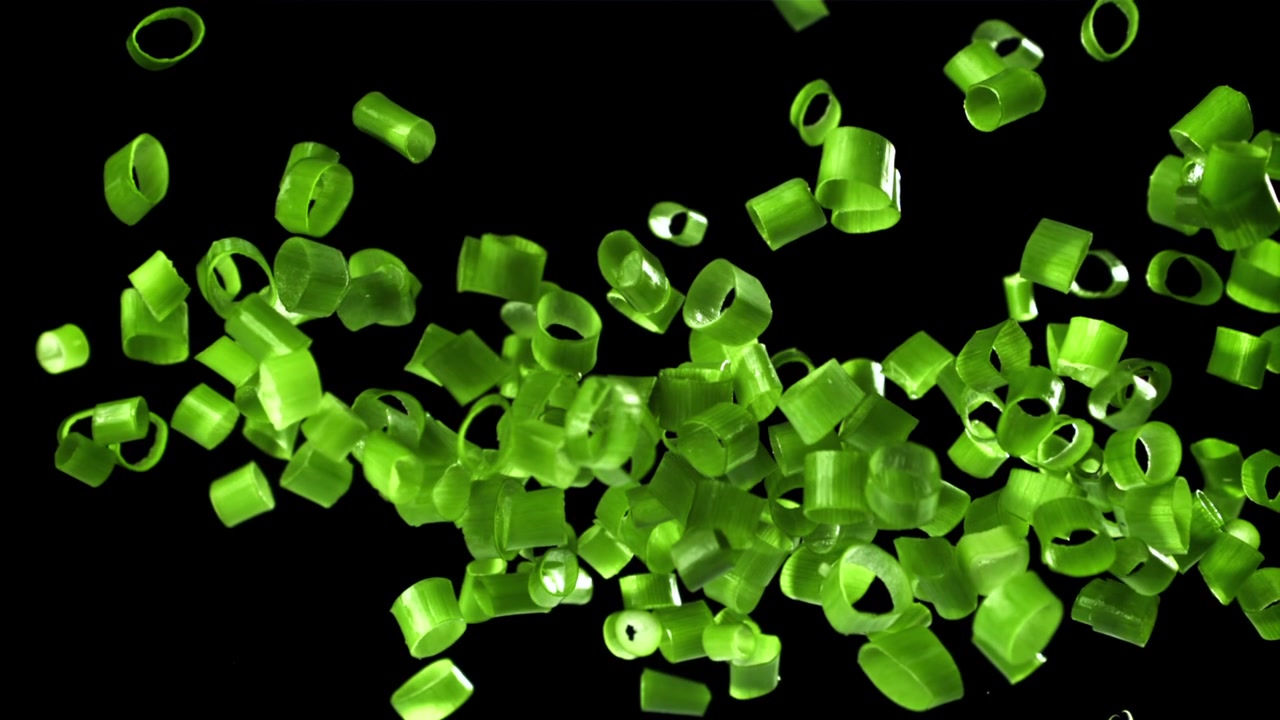 Chopped Green Onions Falling and Floating in Slow Motion