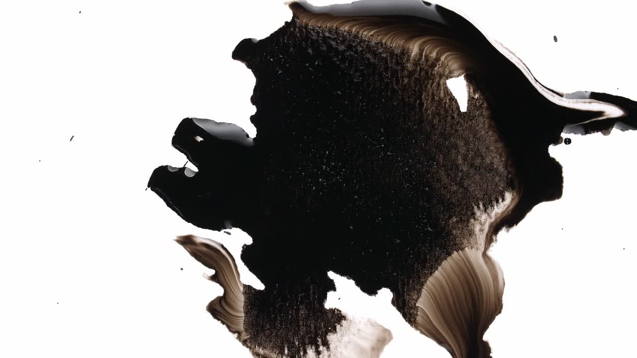 Black Ink Drops On White Background