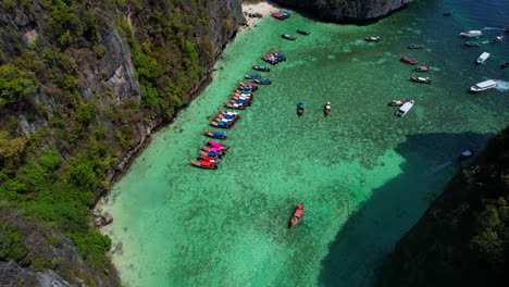 traditional long tail boats in famous pileh lagoon, thailand