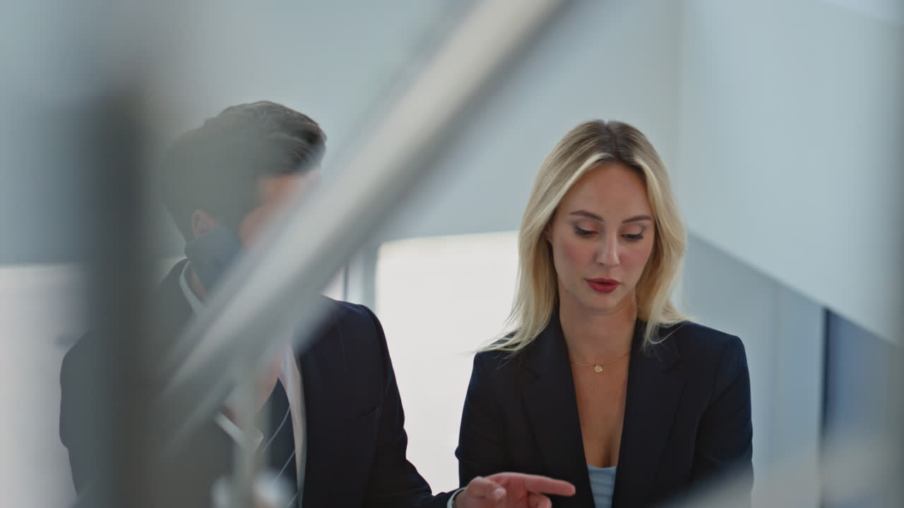 Talking business people walking up stairs office closeup. Businessman speaking