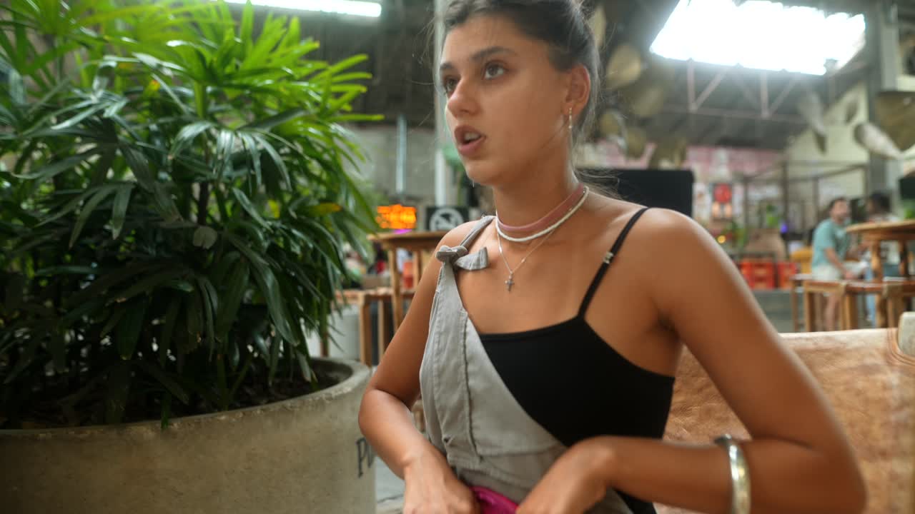 A woman sitting in a public area