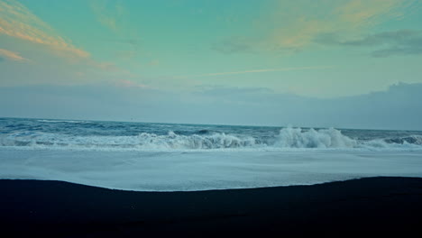 breathtaking view of big rough waves crushing on the shore of reynisfjara beach in iceland