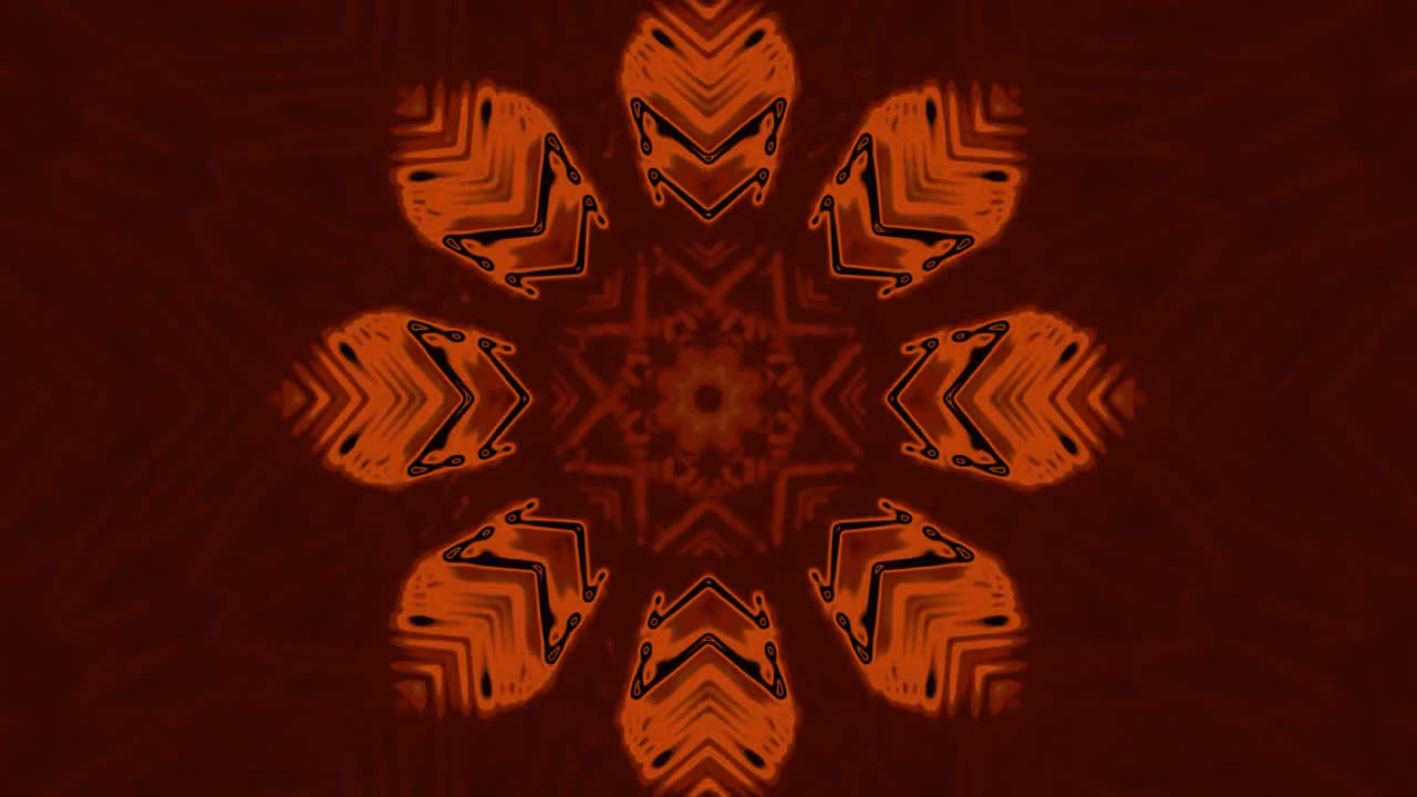 Intricate patterns form a mesmerizing floral design in vibrant orange hues against a deep backdrop. This captivating display creates a soothing atmosphere, ideal for relaxation or meditation