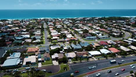 flying above surfer's paradise homes and shore