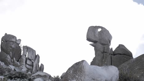 rock formation shaped like a dinosaur in snowy sierra de guadarrama, madrid