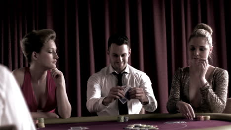 Man-sitting-winning-at-poker-