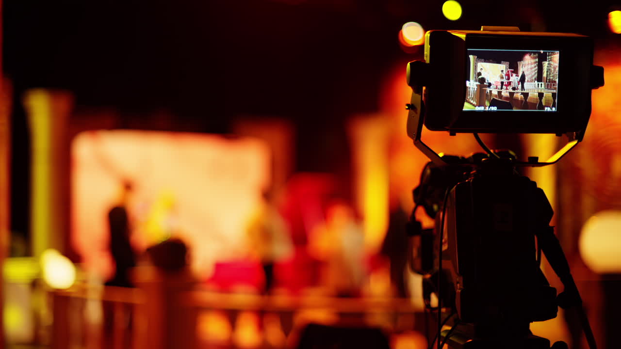 Professional camera filming with on the backstage of a TV set
