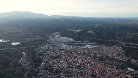 aerial view of a european city with mountains in the background