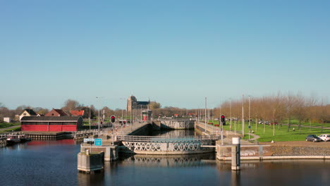 Aerial:-The-locks-of-the-Canal-through-Walcheren,-near-the-historical-town-Veere