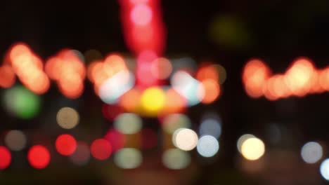 blurry bokeh lights at night with cars and lanterns, vibrant festive street background