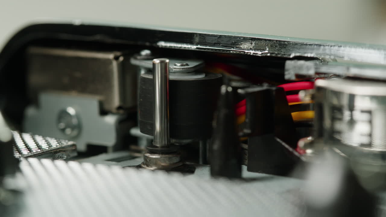 Vintage cassette player on a desk with headphones and tapes creates a nostalgic audio scene, evoking retro vibes