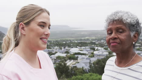 Smiling-caucasian-nurse-with-senior-woman-patient-with-copy-space,-slow-motion