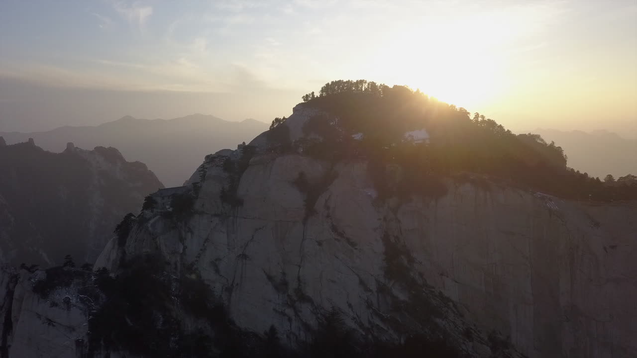 Sun flare aerial high on famous scenic granite mountain, Mt Huashan