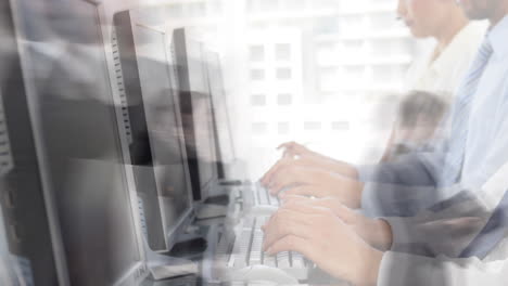 animation of team of colleagues typing on computer keyboards with people walking in fast pace