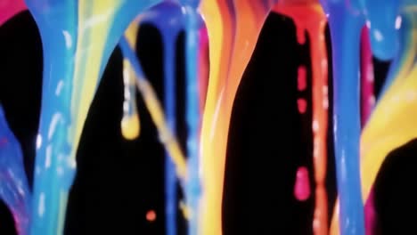 bright splashes of paint in multiple colors cascade in a striking display. the vibrant hues create an eye-catching visual effect.