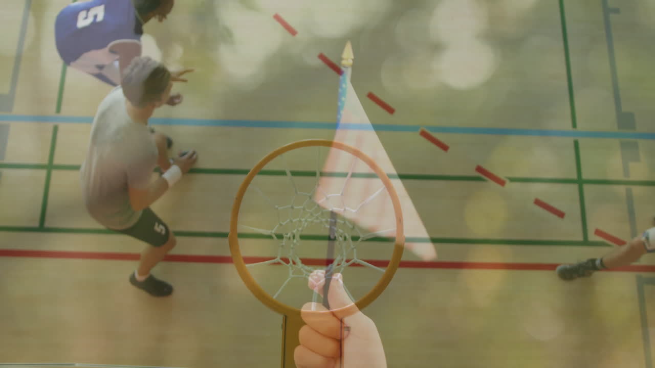 Basketball players on court with American flag animation overlay on hoop
