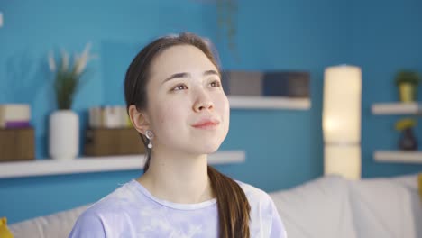 Portrait-of-happy-and-peaceful-Asian-young-woman.