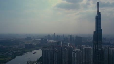 Landmark-building-and-Central-Park,-river-and-city-skyline-with-container-barges-on-the-river