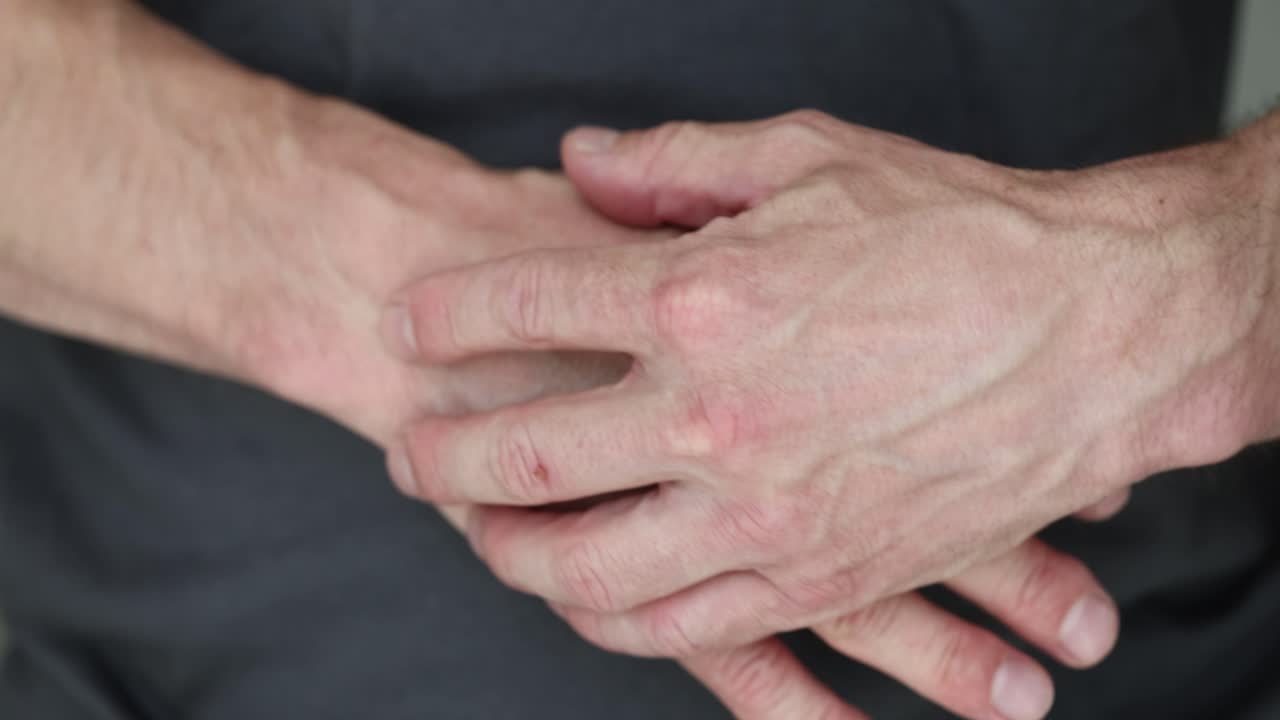 Close-up of human hands with visible veins
