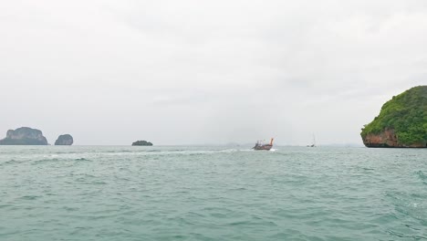 boat travels across ocean near krabi islands