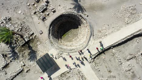 Aerial-view-of-tourist-visiting-Megiddo-National-Park,-Israel