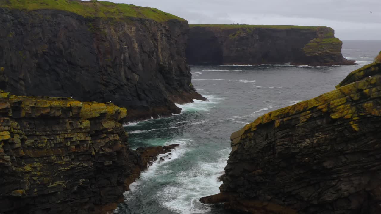 Aerial view of sea stacks and rugged coastline at Kilkee Cliffs