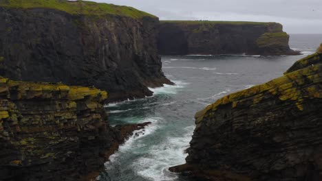 aerial view of sea stacks and rugged coastline at kilkee cliffs