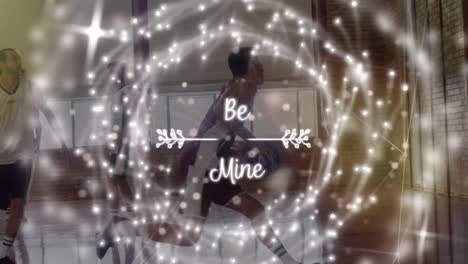 animación de texto de be mine y puntos de luz sobre un grupo diverso de jugadores de baloncesto en el gimnasio