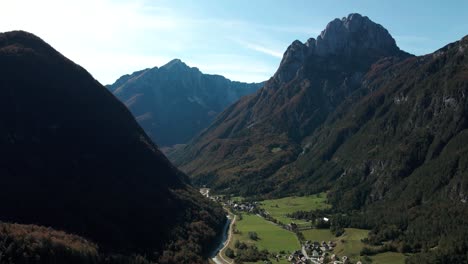 koritnica valley aerial small town between green mountains sunny day