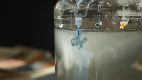 blue ink swirling in water