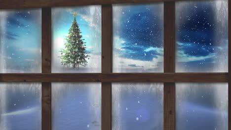 Wooden window frame against snow falling over christmas tree on winter landscape