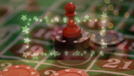 animación de luces de hadas en forma de estrella brillante contra los dados rojos sobre la pila de fichas de póquer de casino