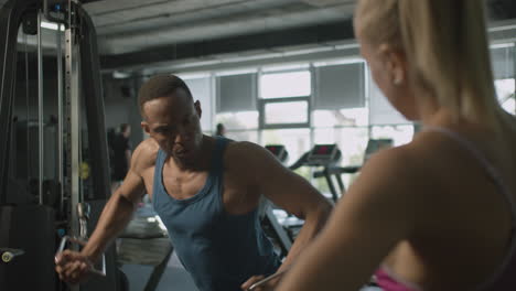 Front-view-of-an-athletic-african-american-man-in-the-gym.