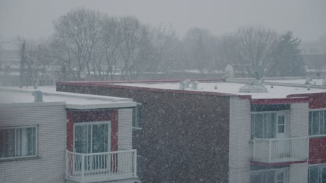 outside apartment building roof covered with winter snow during cold cloudy day in canada