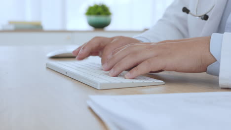 doctor, keyboard and typing with hands of man