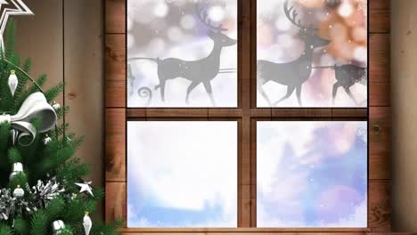 Animation-of-santa-claus-in-sleigh-with-reindeer-in-winter-scenery-seen-through-window