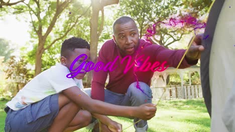 animation of good vibes text with african american father and son