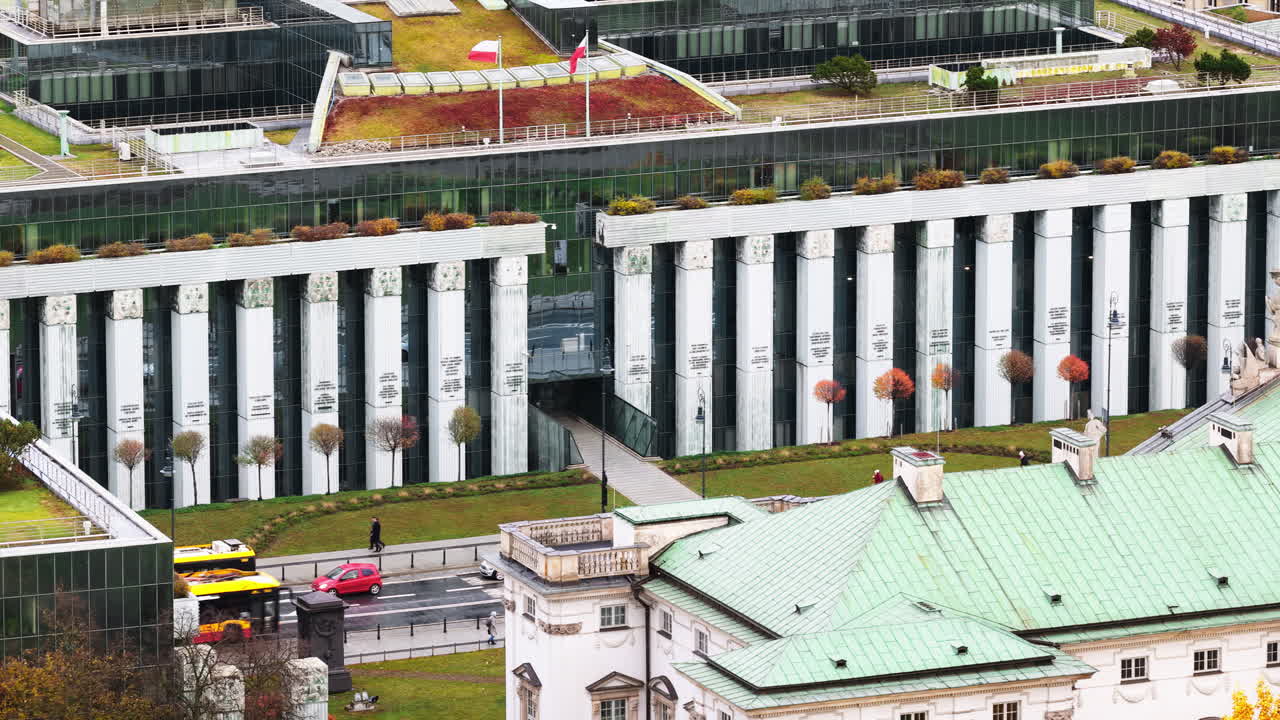 Aerial drone view of the Supreme Court of Poland in Warsaw with urban surroundings and light pedestrian movement
